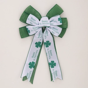St. Patrick's Day layered bow decoration with shamrock patterns and green mesh texture