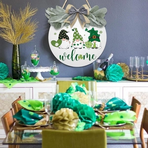 Round St. Patrick’s Day wooden welcome sign featuring festive gnomes and green shamrock decor