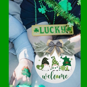 Detail of St. Patrick's Day welcome sign with gnomes and Lucky gold plaque ornament