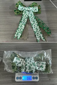 Detailed view of St. Patrick's Day green clover bow on a digital scale for weight check