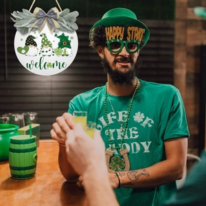 Detail of St. Patrick's Day wooden welcome sign with green gnomes and shamrock decor