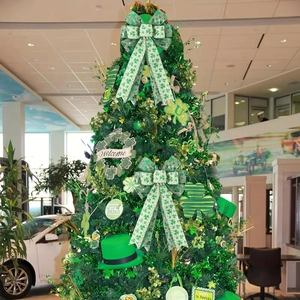 Detailed view of St. Patrick's Day glitter tree with shamrock bows and green hats