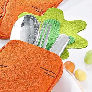Macro view of orange felt carrot-shaped cutlery holder with stainless steel utensils inside