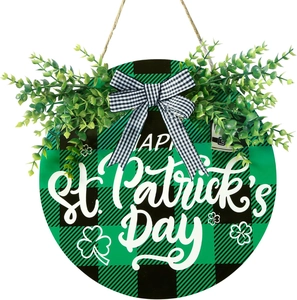 Detail of St. Patrick's Day welcome sign with green buffalo plaid and festive bow