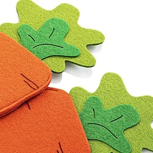 Macro view of carrot-shaped felt utensil holders with orange and green stitching details