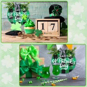 Close-up of St. Patrick's Day welcome door sign with green leaves and buffalo plaid bow
