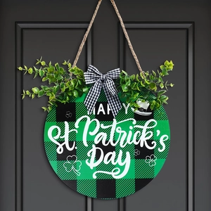 Macro detail of St. Patrick's Day door sign with buffalo plaid and artificial greenery