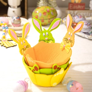 Detailed view of colorful Easter felt storage baskets with cute bunny ears and bow ties