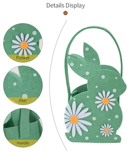 Detail display of green felt Easter bunny basket with daisy flowers and sturdy handle
