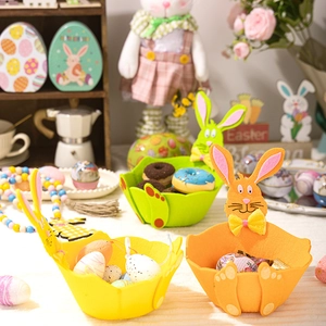 Detailed close-up of felt Easter baskets with bunny ears and bows in vibrant colors