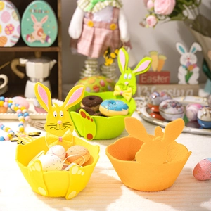 Detailed view of colorful Easter bunny felt baskets used for egg storage and decor