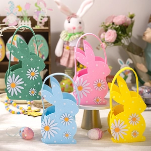 Detail of colorful Easter felt bunny baskets with daisy decor and felt handles