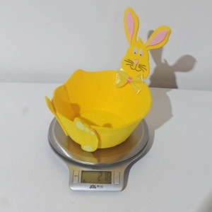 Detailed view of lightweight yellow felt Easter bunny basket weighing 21.8 grams
