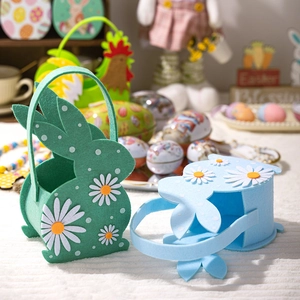 Detail of Easter felt bunny baskets in green and blue with daisy and polka dot motifs