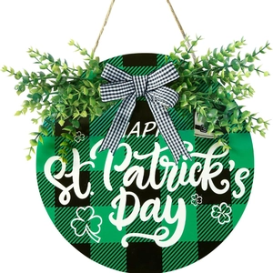 Round St. Patrick's Day welcome door sign with buffalo plaid, bow, and green leaves