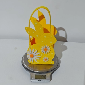 Detailed view of lightweight yellow felt Easter bunny basket weighing about 29 grams