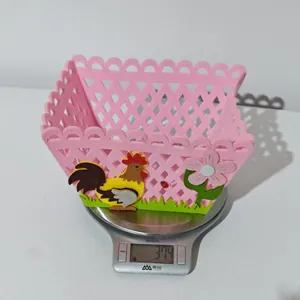 Detailed view of pink felt Easter rooster basket showing weight on digital scale