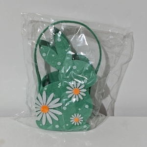 Green felt Easter bunny basket with daisy floral details and white polka dot accents