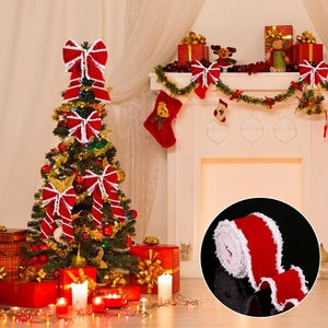 Close-up of red velvet Christmas ribbon with white faux fur trim on a decorated festive tree