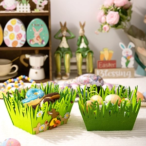 Detail of green felt Easter baskets with grass edge and bunny embroidery decorations