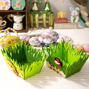 Detail of green felt Easter baskets with grass edge, wooden fence, and ladybug accents