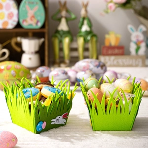 Detail of green felt grass Easter baskets with bunny and egg appliques for decor