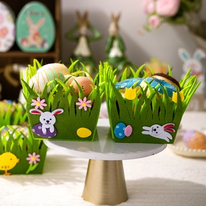 Close-up of green felt Easter basket with bunny and egg appliques on a display stand