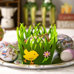 Close-up of Easter felt basket with chick decor and vintage illustrated eggs on a tray