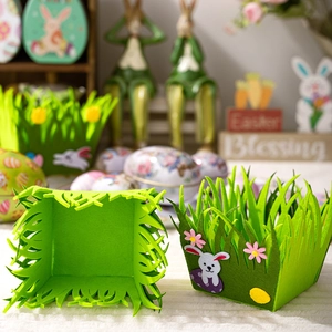 Detail of green felt Easter storage baskets with bunny and flower applique decorations