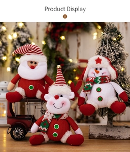 Detailed close-up of plush Christmas ornaments including Santa, reindeer, and snowman