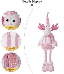 Detail view of pink sequin scarf, extendable legs and eyes on Christmas elk plush doll