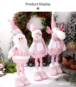 Detailed view of pink sequined Christmas plush figurines with knit fabric textures