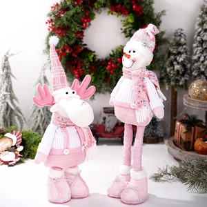 Close-up of pink Christmas plush reindeer and snowman set with sparkling sequin scarves