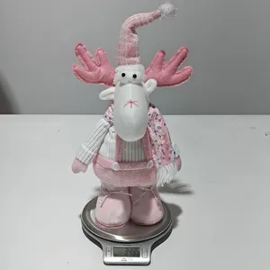 Detail showing pink Rudolph reindeer plush doll weight on an electronic scale