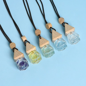 Five-piece set of triangular glass car perfume bottles with wooden caps and dark cords