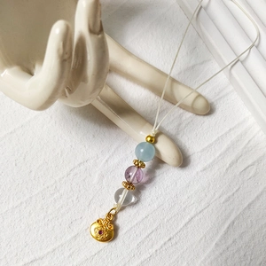 8mm natural crystal phone charm featuring sky blue beads and a golden Ruyi lock pendant