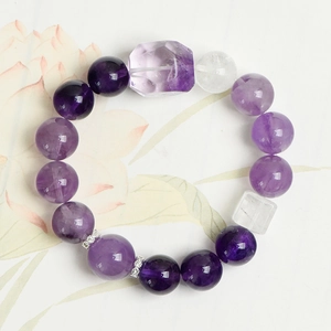Handmade amethyst and clear quartz crystal beaded bracelet with floral background