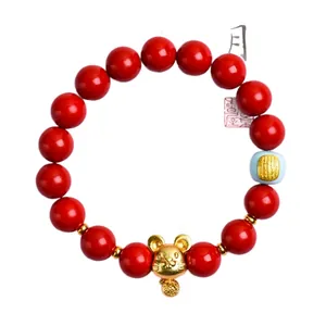 Traditional Chinese cinnabar bracelet with red beads and a golden zodiac rat charm
