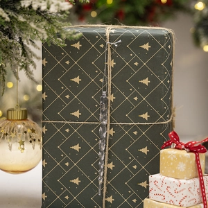 Close-up of a clear acrylic spiral icicle ornament hanging on a festive gift box