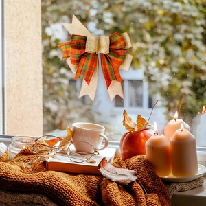 Close-up of handmade linen plaid festive bow on a cozy winter window display