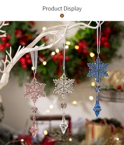 Detailed view of colorful acrylic snowflake pendants with teardrop beads and white ribbons
