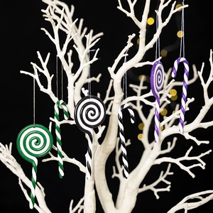 Christmas striped lollipop and candy cane ornaments in green, black, and purple colors