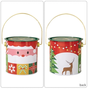 Détail du seau de Noël en métal avec illustrations du Père Noël et poignée dorée