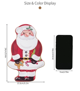 Size comparison of Santa Claus tin tray measuring 24cm by 15.5cm next to a smartphone