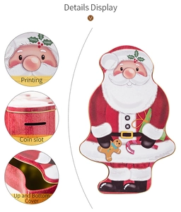 Detail view of Santa Claus tin box showing coin slot, lid fitting and printing quality