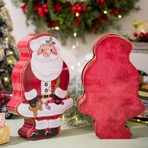 Detail of Santa Claus tin gift box with festive illustrations and red metal back