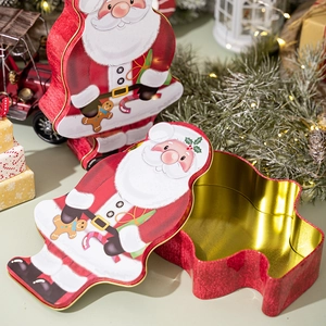 Detailed view of open Santa Claus tin box with golden interior for Christmas candy
