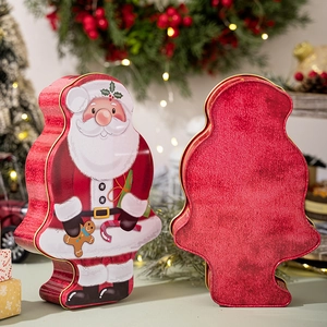 Christmas Santa Claus tin box with festive gingerbread man and candy cane patterns