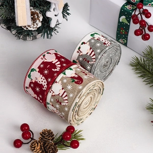 Christmas gnome patterned ribbons with pine cones and berries on white background