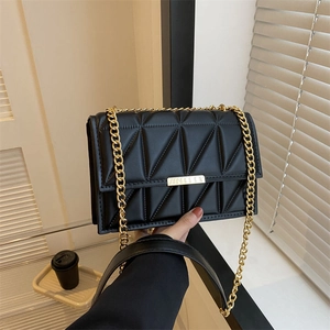 Modern black geometric quilted crossbody bag with stylish gold chain strap for women